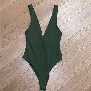 Green low cut body suit